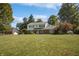 Charming two-story home featuring a combination of brick and white siding with a well-maintained lawn and mature trees at 5363 Channing Rd, Indianapolis, IN 46226