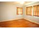 Light-filled bedroom with hardwood floors and large windows, providing an open and inviting atmosphere at 5363 Channing Rd, Indianapolis, IN 46226