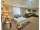 Finished basement with carpeted flooring, a bed, couch, and natural light from a window at 6036 Chinkapin Dr, Columbus, IN 47201