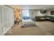 Finished basement featuring a spacious layout with a bed and comfortable seating area at 6036 Chinkapin Dr, Columbus, IN 47201