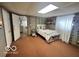 Bright bedroom featuring a bed, stylish decor, and carpet at 6036 Chinkapin Dr, Columbus, IN 47201