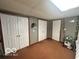 Bedroom featuring storage and decor, with carpeted flooring at 6036 Chinkapin Dr, Columbus, IN 47201