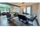 Open-concept layout with modern dining area adjacent to a stylish living room at 6036 Chinkapin Dr, Columbus, IN 47201