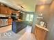 Charming kitchen features a large island, stainless steel appliances, and custom cabinets at 6036 Chinkapin Dr, Columbus, IN 47201