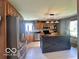 Charming kitchen features a large island, stainless steel appliances, and custom cabinets at 6036 Chinkapin Dr, Columbus, IN 47201