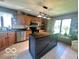 Charming kitchen features a large island, stainless steel appliances, and custom cabinets at 6036 Chinkapin Dr, Columbus, IN 47201