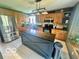 Charming kitchen features a large island, stainless steel appliances, and custom cabinets at 6036 Chinkapin Dr, Columbus, IN 47201