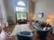 Spacious living room featuring high ceilings, large windows, and comfortable seating arrangements at 6036 Chinkapin Dr, Columbus, IN 47201