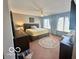 Spacious main bedroom with natural light, a ceiling fan, and neutral decor at 6036 Chinkapin Dr, Columbus, IN 47201