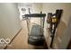 Storage area featuring a treadmill and vacuum cleaner for convenient cleaning at 6036 Chinkapin Dr, Columbus, IN 47201