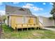 Newly constructed wooden deck adds appeal to this charming home backyard with partial fencing at 604 Wood St, Greenfield, IN 46140