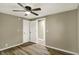 Bedroom featuring a ceiling fan and access to two closets at 604 Wood St, Greenfield, IN 46140