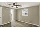 Bedroom featuring a ceiling fan, window, and ensuite access at 604 Wood St, Greenfield, IN 46140