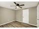 Bedroom featuring a ceiling fan, light walls, and closet at 604 Wood St, Greenfield, IN 46140