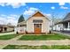 Cozy home exterior featuring manicured lawn and decorative cedar accents at 604 Wood St, Greenfield, IN 46140
