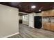 Open concept kitchen and living area with wood floors and a view to the dining room at 604 Wood St, Greenfield, IN 46140