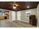 Well-lit living room featuring an interior door to the kitchen and wood ceiling at 604 Wood St, Greenfield, IN 46140