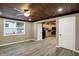 Bright living room with an interior door to the kitchen and beautiful floors at 604 Wood St, Greenfield, IN 46140