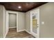 Bright, wood-ceiling room with a back door and additional doorway at 604 Wood St, Greenfield, IN 46140