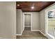 Wood-ceiling room with open doorways and an outdoor exit to the backyard at 604 Wood St, Greenfield, IN 46140