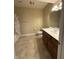 Functional bathroom with a tiled floor, bath tub, and a vanity with storage at 6087 Boulder Ct, Columbus, IN 47201