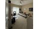 Functional bedroom with a desk, chair, and a comfortable bed with neutral decor at 6087 Boulder Ct, Columbus, IN 47201