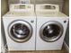 Convenient laundry room with modern, front-load washer and dryer units at 6087 Boulder Ct, Columbus, IN 47201