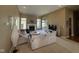 Spacious living room features neutral walls and carpet, a fireplace, and large windows at 6087 Boulder Ct, Columbus, IN 47201