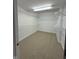 Spacious walk-in closet featuring extensive shelving, and neutral carpeting at 6087 Boulder Ct, Columbus, IN 47201