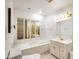 Bright bathroom with a soaking tub, vanity, and multiple mirrors, creating a clean and functional space at 6150 Red Day Rd, Martinsville, IN 46151