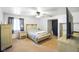 Bright and inviting bedroom with natural light, soft carpet, fan and neutral tones for a relaxing atmosphere at 6150 Red Day Rd, Martinsville, IN 46151