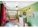 Cozy bedroom featuring unique decor with a bed, dresser, and Adventure themed wall banner for a unique design at 6150 Red Day Rd, Martinsville, IN 46151