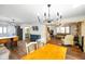 Open concept kitchen, dining, and living room with wood floors, offering a great flow for entertaining and relaxation at 6150 Red Day Rd, Martinsville, IN 46151