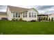 Lovely backyard featuring mature trees, green lawn, and shaded patio area at 6717 Marble Arch Way, Indianapolis, IN 46259