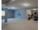 Basement featuring neutral walls, carpet floors, recessed lights, exercise equipment, and a window at 6717 Marble Arch Way, Indianapolis, IN 46259