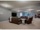 Finished basement space with neutral walls, carpet floors, recessed lights, and comfortable seating at 6717 Marble Arch Way, Indianapolis, IN 46259