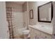 Bathroom featuring a shower-tub combo, a toilet, and a vanity with a sink at 6717 Marble Arch Way, Indianapolis, IN 46259