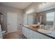This bathroom features double sinks, lots of cabinet space and separate tub and shower at 6717 Marble Arch Way, Indianapolis, IN 46259