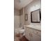 Bathroom featuring a shower-tub combo, a toilet, and a vanity with a sink at 6717 Marble Arch Way, Indianapolis, IN 46259