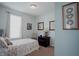 This bedroom has ample natural light, neutral paint and a custom quilt at 6717 Marble Arch Way, Indianapolis, IN 46259