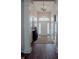 Inviting foyer showcasing hardwood floors, elegant lighting, and stylish decor at 6717 Marble Arch Way, Indianapolis, IN 46259