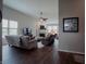 Bright living room with a fireplace and hardwood flooring at 6717 Marble Arch Way, Indianapolis, IN 46259