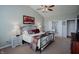 This spacious main bedroom includes a ceiling fan, ensuite bathroom, and lots of natural light at 6717 Marble Arch Way, Indianapolis, IN 46259