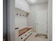 This custom mudroom offers seating, hanging storage, and upper and lower cabinets at 6717 Marble Arch Way, Indianapolis, IN 46259