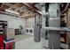Utility room featuring a washer, dryer, shelving, a water heater, and exposed ductwork at 6717 Marble Arch Way, Indianapolis, IN 46259