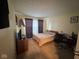 The cozy bedroom features carpeting and decor at 676 Sunblest Blvd, Fishers, IN 46038