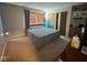 A spacious bedroom with natural light features built-in shelves and ample storage at 676 Sunblest Blvd, Fishers, IN 46038