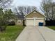 Attractive single-story home with a double garage, long driveway, and neat landscaping at 676 Sunblest Blvd, Fishers, IN 46038