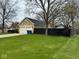 A two-car garage sits next to a well-maintained lawn, providing ample parking and curb appeal to the home at 676 Sunblest Blvd, Fishers, IN 46038