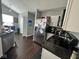 The kitchen features granite countertops, stainless steel appliances, and white cabinets for a modern aesthetic at 676 Sunblest Blvd, Fishers, IN 46038